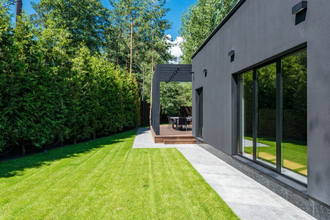 Modern Ottawa home exterior with manicured lawn, ready to sell